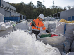 Worker Checks Plastic Resins Ready for Reuse in Manufacturing