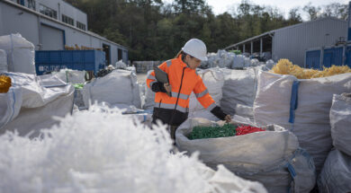 Worker Checks Plastic Resins Ready for Reuse in Manufacturing