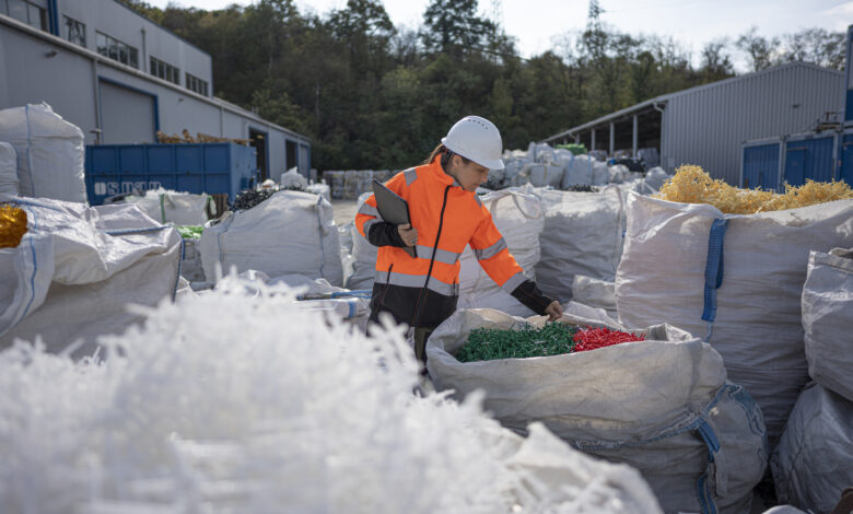 Worker Checks Plastic Resins Ready for Reuse in Manufacturing