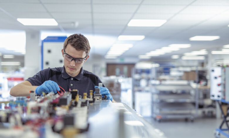 Apprentice engineer in medical electronics machinery manufacturing factory