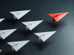Different business concept.new ideas. paper art style. creative idea.Business competition concept with Colorful paper planes.3D rendering on black background.
