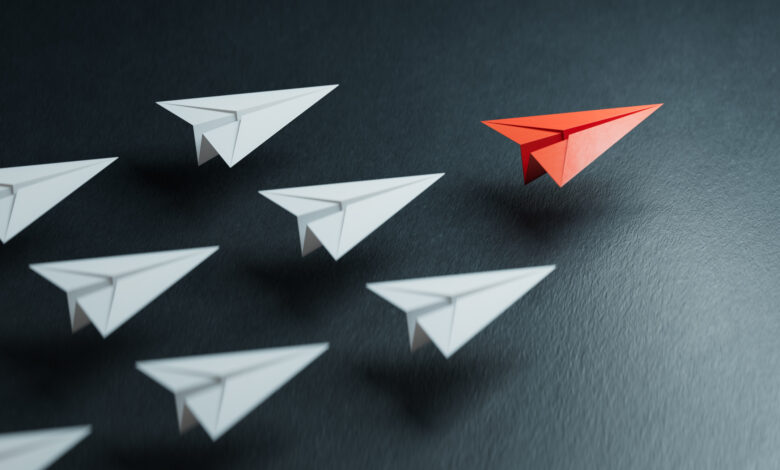 Different business concept.new ideas. paper art style. creative idea.Business competition concept with Colorful paper planes.3D rendering on black background.