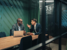 Business consultants reviewing strategy in contemporary office setting