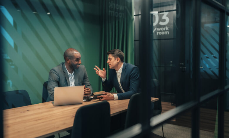 Business consultants reviewing strategy in contemporary office setting