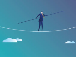 Business man walks on the wire rope